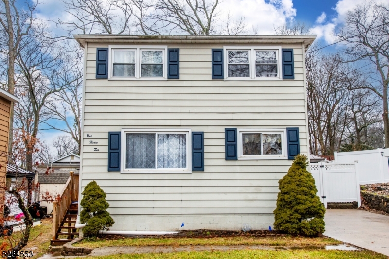 Why rent when you can own this adorable, move in ready, renovated two bedroom Colonial and enjoy lake privileges with formal dining room, living room, hardwood flooring, beautiful tumbled marble tile in master bathroom, tiled kitchen, brand new french doors lead to a massive deck & gazebo, great for those fur babies or entertaining, vinyl fenced in yard, full walkout basement for storage, possible workshop, utility room, new fixtures and recessed lighting throughout, plenty of natural lighting, new doors, new electrical panel, parking for four cars, nice curb appeal, freshly painted, immaculate, can walk to local beach, close to the Hopatcong State Park, easy access to shopping & to all major routes like 80, 46 and 10, only an hour from New York City and low taxes.  Appliances are "As Is" as well as Central Air Conditioning!
