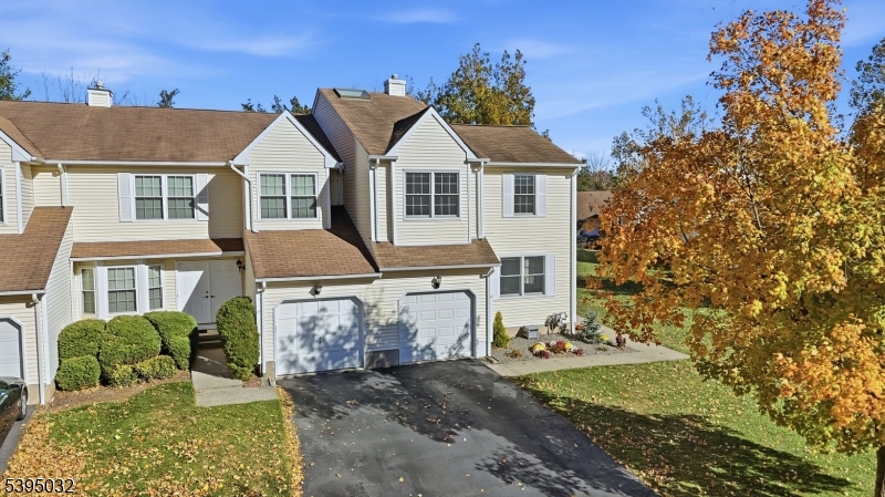 Welcome to Chambers Brook, one of Branchburg's most sought after communities! This beautifully maintained 3 bedroom, 2.1 bath end unit townhouse is the perfect place to call home. Tucked away at the end of a quiet cul-de-sac, it offers the ideal blend of privacy, convenience, and style. Enter through the open side yard into a warm, inviting interior featuring gleaming hardwood floors and a versatile den, currently a playroom, but can easily be used as a home office. The impressive two story living room showcases a wood burning fireplace, elegant palladium windows, and vaulted ceilings that fill the space with natural light. The spacious dining area opens to a deck, perfect for grilling, morning coffee or relaxing at night. The well appointed kitchen offers stainless steel appliances, hardwood flooring, and potential for an island to expand your culinary space. A powder room, laundry area, and direct garage access complete the first level. Upstairs, the primary suite fits a king bed and features dual closets (one walk in) and a private ensuite with a soaking tub and stall shower. Two additional bedrooms and a full bath complete the upper level. The large unfinished basement provides endless potential for recreation or storage. Freshly painted and move in ready, this home is minutes from Somerville, Bridgewater, and Flemington, with easy access to major highways, NJ Transit, shopping, parks, and dining. Low quarterly HOA of $258.50 includes lawn maintenance!