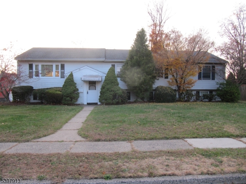 Welcome to this Large House.. 5BR, 3 FBTH, 2 car Garage expanded Bi-Level (app. 2416 sqft) in the prestigious Wayne Hills Section with a large level yard (app.100 x 150), an entertainer's paradise. Why go away when you can enjoy your fenced in Built-In pool (app.18 x 36) and a nice size yard, all on a quiet street (NO flood zone) with Municipal Water & Sewer. Close to Schools, Shopping, Parks. and Transportation. EF w/CT flr. & coat closet. HDWD frs and new w/w where installed. Ground Flr: Family rm (22-9 x 18-1) w/Dry Bar. FBTH w/CT flr. & SS. Lndry rm washer/dryer & OE to BKYD. Rec rm / Game rm / Office / Poss. 6th BR (22-9 x 15-2) if needed / potential In-Law Suite with OE to BKYD. 2 car attached garage, 1 w/remote & xlg driveway for 6+ cars. Utility room w/4 zone gas HWBB type heat, 50 Gal. gas HTWTRHTR, 200-amp CB. 1 zone Central Air. 2 strg sheds in "as - is condition. First Flr: Living rm w/w carpet, Dining rm w/laminate flr., Eat In Kitchen, Hallway Linen closet, Hallway FBTH w/dbl sink & CT flr. Attic fan. BR (10 x 10-6) w/HDWD flr., PBR (12-5 x 14-6) w/pvt FBTH & ceiling fan, BR (7-8 x 11) w/Laminate flr., BR (12 x 13) w/w & Ceiling fan, BR (11-9 x 13-2) w/w & Ceiling fan. Pull-Down stairs to semi-flrd Attic for additional strg. Please note that the condition of the house was taken into consideration when pricing & was priced accordingly. Great location just needs some updating and your finishing touches. Will not last. Priced to sell. Hurry, make your offer today!!