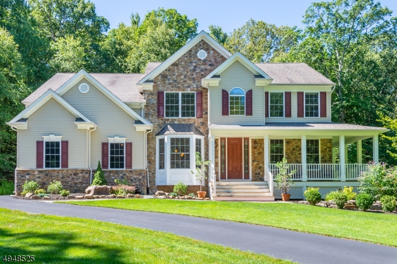 Forest Ridge colonial w/ mahogany wrap-around porch offers privacy, while being part of a tucked away enclave of fine homes. Minutes to the eclectic restaurant scene of downtown Hackettstown, shopping and NJ Transit train. This beautiful home was built in 2005 and features bright, natural light, a gorgeous front door leading to a 2-story foyer, 1st floor private home office with adjacent full bath, hardwood flooring, family room w/ soaring ceilings and wood burning fireplace, center island kitchen with granite counter tops, Thermador commercial range with vent hood, pantry and recessed lighting. The first floor also has formal living room and dining room w/ butler's pantry. Four spacious bedrooms, incl master suite with tray ceiling, a loft area and 2 full baths complete the 2nd floor. Close to Rts. 80 & 46.