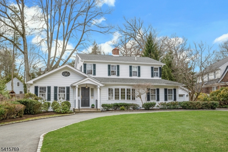 This beautifully maintained Colonial is set on a .37-acre level lot in a sought-after Summit Northside location, offering an exceptional combination of space, flexibility, and outdoor enjoyment. The large, flat backyard provides a rare and inviting setting for outdoor living, gardening, or recreation, and is fully fenced for added privacy. Inside, the home features a flexible floor plan with the option for a first- or second-floor primary bedroom, allowing the layout to adapt to a variety of living needs. The office can easily be transformed into a 5th bedroom. The renovated kitchen and updated baths add modern comfort, while the kitchen and family room overlook the expansive rear yard. An inviting sunroom with radiant heat offers a bright, comfortable space to relax year-round. Additional highlights include hardwood floors throughout, multi-zone heating and air conditioning, custom built-ins, a fireplace, California Closets, circular driveway, underground sprinkler system, security system, and generator. Conveniently located near Summit's vibrant downtown, transportation, and parks, this home offers an ideal blend of comfort, versatility, and a standout property setting.