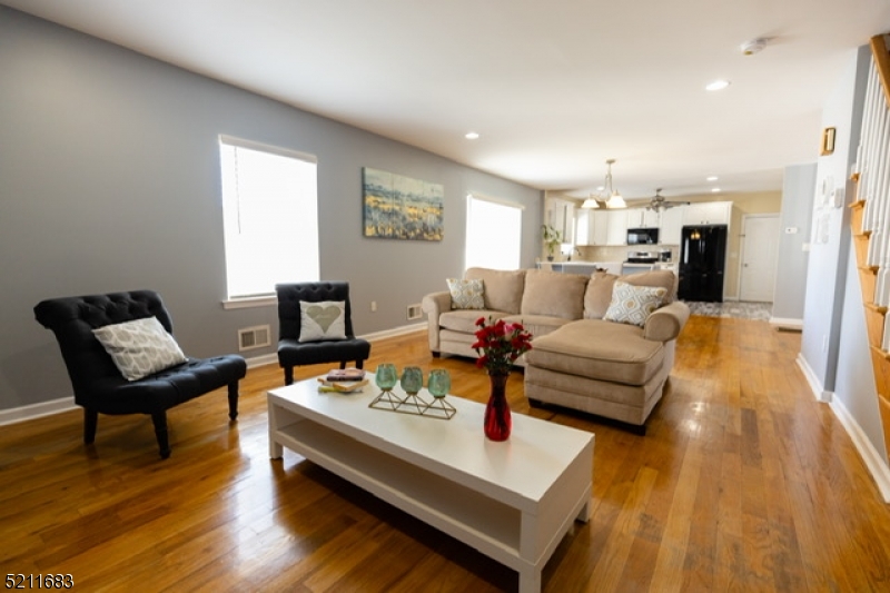 Gorgeous Renovated Colonial in the heart of Roselle Park is ready for new owner! Inviting enclosed porch giving access to the open concept first floor with living room, dining room, eat in kitchen with lots of cabinets and huge pantry, and powder room. Second floor with 3 ample bedrooms, including master with lots of closet space and full bath in hallway. Third floor with one bedroom, family room and full bath. Immaculate unfinished basement with endless possibilities. Kitchen has access to the huge fenced in yard with a gorgeous patio recently done and lots of green space. One car detached garage with a room that could be used for storage (currently used as a playroom).   Double Lot. Lots of parking space, for 4+ cars.  Home has 2 zone central air and heating units. Prime location!  2 blocks of elementary and high school and 3 blocks from Roselle Park Train Station with trains to NYC. A must See!