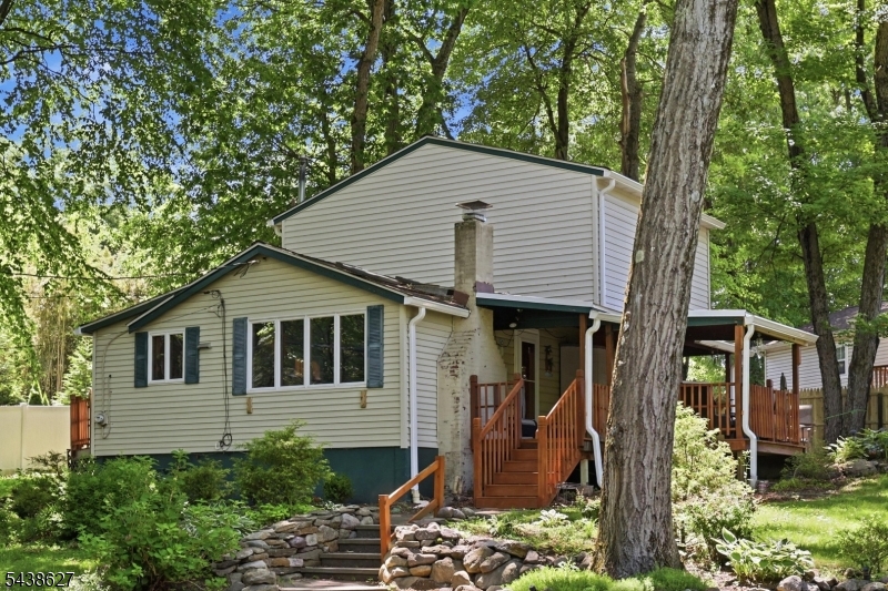 Welcome to the peaceful lifestyle of Fayson Lakes! Tucked just around the corner from the water, this inviting 2-bedroom home offers the serenity and charm that make this lake community so sought after. Step inside to a warm and welcoming dining room with fireplace that moves into an open living room - an easy, comfortable layout made for everyday living and relaxed entertaining. The updated kitchen with convenient side entrance keeps things functional, and the main full bath includes a handy laundry closet. Doors off the living room lead to a paver patio overlooking the koi pond, while the deck offers an inviting sitting area - the perfect spot for morning coffee or unwinding at the end of the day. Lake membership is required, opening the door to swimming, kayaking, and the year-round social calendar that gives this community its special character. Whether you're downsizing, starting out, or searching for a weekend retreat, this is a wonderful opportunity to embrace the charm and connection of lake life. Please confirm all fees. Fireplace as-is.