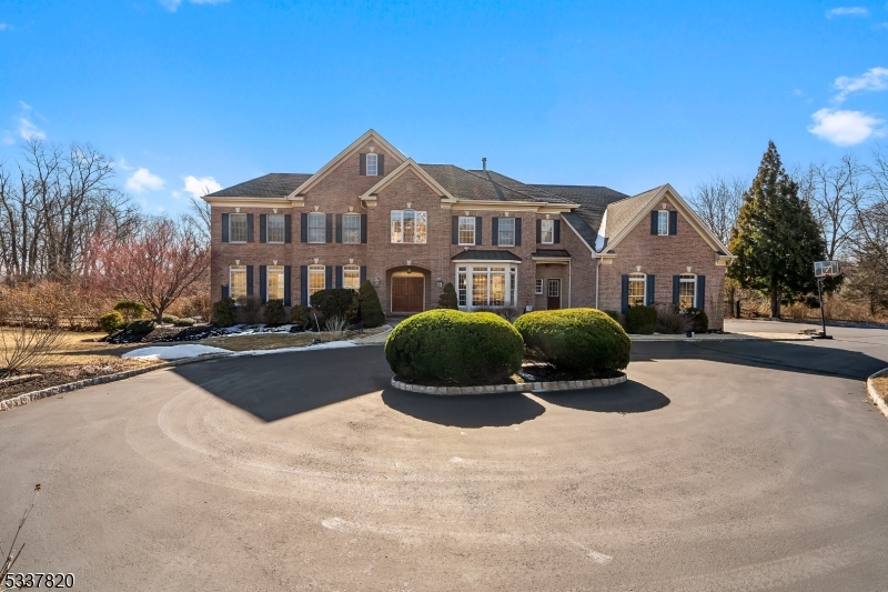 Nestled at the end of cul-de-sac, this magnificent home sits on an unparalleled lot with a breathtaking park-like setting. A circular driveway leads to a gorgeous in-ground pool, hot tub, and cascading waterfall an outdoor oasis perfect for entertaining.Inside, custom features and upgrades abound. The light-filled gourmet kitchen boasts custom cabinetry, granite countertops, and new stainless-steel appliances. The elegant foyer opens to multiple inviting spaces, including three rooms with cozy fireplaces.The luxurious master suite offers two sitting rooms, two walk-in closets, and a spa-like bath. The finished lower level, with a full bath and recreation room, opens through glass doors to the pool and beautifully landscaped patio, seamlessly blending indoor and outdoor living. A must see!
