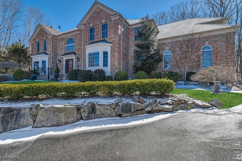 Situated on over 3 acres, this exquisite Colonial is the epitome of luxurious living. With no detail overlooked, this home has been updated to true perfection. Step through the custom Adler wood door , where an impressive center staircase hints at the elegance to come. Gleaming hardwood floors lead you deeper into the home, where the two-story family room with statement fireplace takes center stage. Enjoy games in the adjacent billiards room. The renovated kitchen is ready for gourmet cooking, with an over sized center island and state-of-the-art appliances. The master suite features French doors, dual closets and a spa-like master bath. The lower level has a recreation room, gym and a 500 bottle wine cellar. When luxury living is your idea of a dream home, look no further than this stunning Colonial.