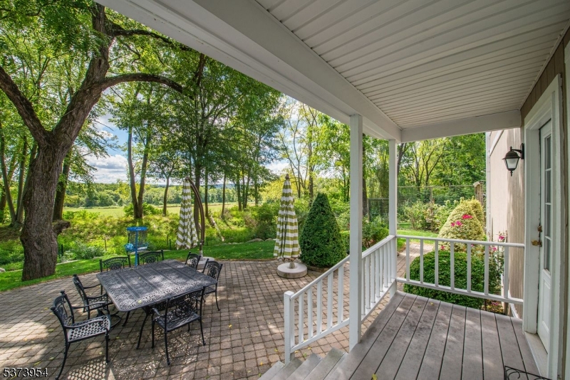 A beautiful Oasis & Privacy is what you will experience at this lovely 4 bedroom plus den, 2 1/2 bath Charming Colonial. The natural attractiveness of the lush scenery will fascinate you. You are walking into "A Garden of Paradise." Enter into the sweet foyer, living room, tastefully decorated with warm colors, freshly painted. There is a formal dining room with natural lighting pleasant to the eye. The kitchen is renovated with impressive granite kitchen counters, backsplash, tiled flooring, gas stove, built-in microwave, pantry & plenty of cabinets for storage & a half bath & laundry adjacent for easy convenience.  Proceed upstairs overlooking a Palandian window that leads to 4 bedrooms, two renovated bathrooms, plus den. New floors have been recently done as well as freshly painted throughout with light appealing colors. All bathrooms have been renovated with engaging decor, which make you feel the warmth and coziness of the home. The open back porch is ideal for drinking your hot cocoa or glass of wine admiring the wilderness. The captivating backyard, which includes a massive paved, patio area, vegetable garden & peach tree are perfect for entertaining & relaxation. Enjoy the luxury of country living without the stress & hustle & bustle of city life. Easy access to Routes 80, 46 & only five minutes from Hackettstown. Where can you purchase a half an acre of property with such low taxes. Calm & tranquility overlooking Green Acres. House is being sold "As Is."