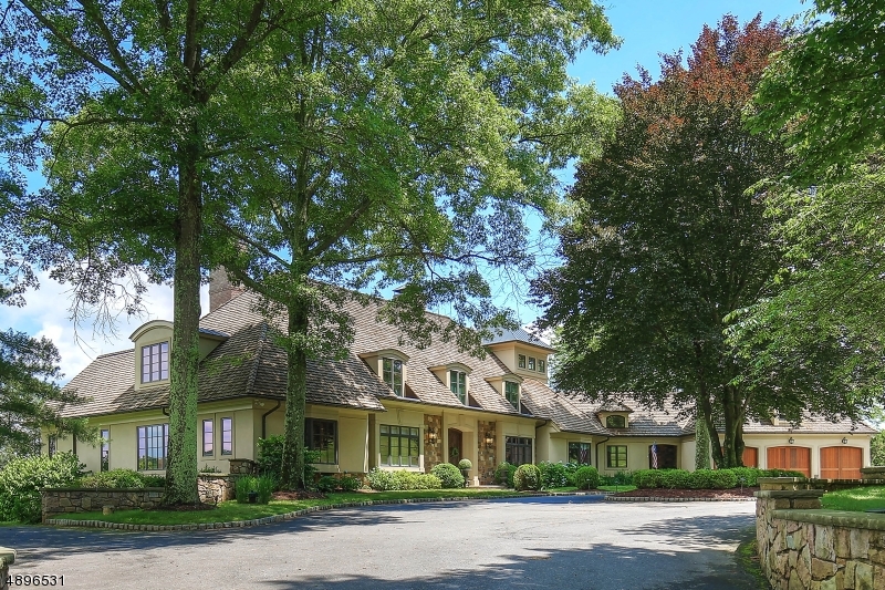 Extraordinary lifestyle home juxtaposed with breathtaking panoramic views of Lake Therese, Roxiticus Golf Club and the Bernardsville mountain! Renowned architect James Timpson designed this home to be one with its surroundings. Indoor and outdoor entertaining spaces include a Lodge style Great Room, Cook's kitchen with true Butler's Pantry, Pub inspired lower level with Wine Cellar, outdoor Kitchen with Bar and Fresh Water Pool and Spa with Gazebo. Further amenities include a custom paneled Library with coffered ceiling and Turret Music room. A Spectacular first floor master suite and five additional en-suite bedrooms are graciously proportioned with custom walk in closets. High end construction and finishes are consistent in this finely crafted home.