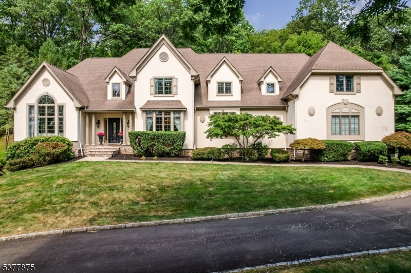 The Epitome of Elegance in one of Warren's premier neighborhoods - This sophisticated manor offers timeless elegance and modern comfort on 1.5 pristine acres. Featuring 5 spacious bedrooms and 4.5 baths,( including two ensuite bedrooms for added privacy) this home is designed for both luxury and function. The Foyer sets the tone for the high-end ambiance throughout. While the formal Living Room is serene and calming, the Great room boasts soaring ceilings, is bathed in natural light and includes one of the home's 2 fireplaces. The Dining Room awaits your holiday dinners, while the informal breakfast area is more relaxed and part of the functional but stylish Kitchen. Designed with practicality, the kitchen abuts the pantry, laundry room and 3 car garage access. The primary suite is a tranquil retreat, with four custom closets and a spa-like bath featuring a Victoria & Albert soaking tub. An elegant home office provides a quiet space for work or study, while the sunroom is a casual area with light from windows on 3 sides, a slider to the sizable back deck and another fireplace. The walkout lower level features a large bedroom, adjacent full bath, a home gym and substantial storage and utility rooms. Home has a whole house Generac generator and Bose Lifestyle 535 Sound system. From manicured landscaping to gracious interior spaces, this property is perfect for everyday living and entertaining in style.