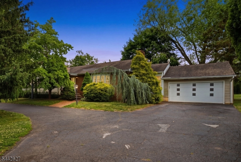 Welcome to this spacious ranch nestled on a beautiful 1-acre lot in desirable Somerset! Offering approximately 2,915 square feet of living space, this well-built home is filled with character, generous room sizes, and endless potential. Features include 3 spacious bedrooms, 1 full and 1 half baths, gleaming hardwood floors, a bright and inviting living room, and a large eat-in kitchen with abundant cabinetry, granite countertops, and plenty of natural light. The oversized family room provides ample space for entertaining and everyday living, while the full basement offers exceptional storage, a retro bar area, workshop space, and Bilco doors for convenient outdoor access. Additional highlights include a circular driveway with dual entrances, a 2-car attached garage, laundry/mud room with exterior access, and two storage sheds. The expansive backyard offers endless possibilities for entertaining, gardening, recreation, or future expansion. Conveniently located near shopping, restaurants, Rutgers University, major highways, and public transportation. A rare opportunity to own a solid home on a picturesque lot and make it your own!