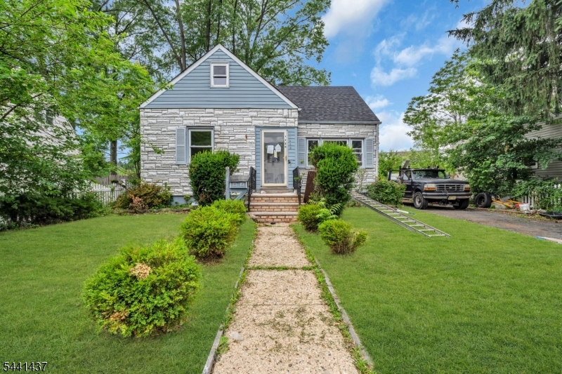 This charming Cape Cod-style home features 4 bedrooms and 2 bathrooms, along with a living room, dining room, and eat-in kitchen. While it lacks a garage, it compensates with a double driveway and a delightful front yard enclosed by a white picket fence. The back patio provides access to a secluded backyard, perfect for relaxation and outdoor activities.