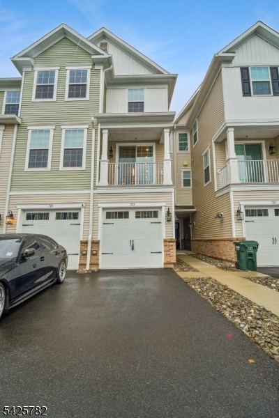 JUST REDUCED!!!!!!!!Luxury Townhome Living: Modern Comfort & Connectivity in sought after Dunellen Crossings! As well as the auspicious /lucky North East facing. This bright and airy three-bedroom townhome offers the perfect blend of modern design and urban convenience. Situated just one block from the train station and steps from bus routes. It provides an effortless commute while maintaining a sophisticated, high-end lifestyle.The heart of the home is the oversized contemporary kitchen with upgraded cabinetry, SS appliances, stylish backsplash, quartz countertops and a sprawling island. The open floor plan creates a seamless flow between the living, dining and the gourmet kitchen. The Second level features a Primary suite with a WIC,  and en-suite bathroom with double vanity. Two additional generously sized bedrooms serviced by a full bath. The versatile loft can be a quiet space for remote work or creative projects.  Large windows and high ceilings ensure the home feels bright, open and inviting throughout the day. Experience a resort-style lifestyle with access to top-tier facilities including a club house, fully equipped state-of-the-art gym, yoga studio to maintain your wellness routine as well as tennis courts for active afternoons.  Enjoy the seasons in the BBQ area and outdoor pool. Over 60,000 in upgrades. This amazing home is complete with an attached 1 car garage for your convenience.  Easy access to Route 22 and 1-287.