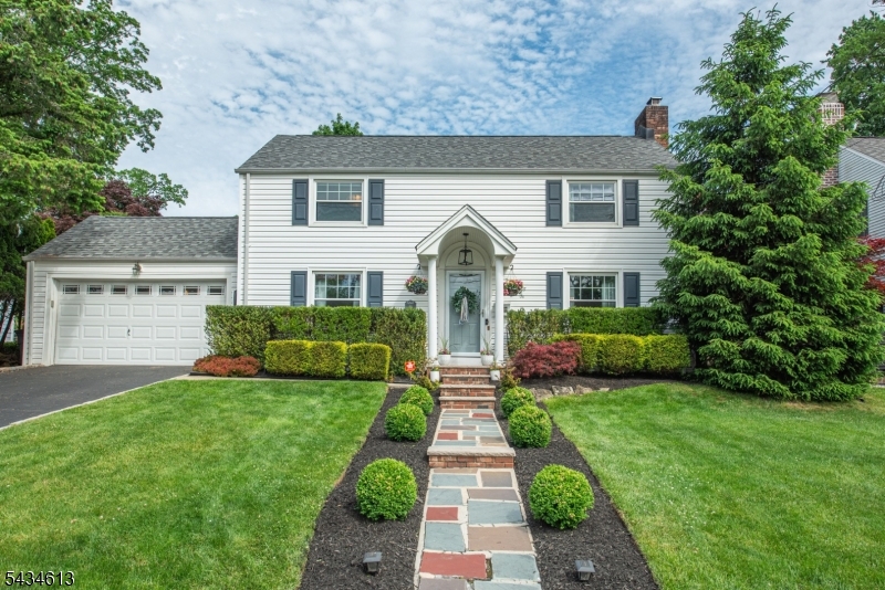 If your vibe is polished, pristine & picturesque, this home stops the scroll & turns heads! Not a detail out of place, this colonial is styled to the nines from every angle! Located in the highly sought after Presidential Section & just a stone's throw from Francisco Park, step inside & the design delivers at every turn. Living room anchors the main floor w/ wood burning fireplace & French doors leading to light drenched sunroom currently used as a playroom. The kitchen delivers rich cabinetry, quality appliances & breakfast bar flowing into formal dining room dressed in bold botanical wallpaper w/ statement lighting. A powder rm on the 1st floor adds everyday convenience. Upstairs, a spacious primary w/ walk-in closet, 2 cozy bedrooms & a full bath offer privacy + comfort. The finished bsmt has theatre screen media room that earns a compliment every time guests arrive! Date night without a reservation. A movie night without leaving the house. The kind of space that makes YOUR house the one everyone wants to come to & nobody wants to leave! The lush & private outdoor area is a showstopper! A beautifully terraced 2 tier backyard w/ paver patio made for outdoor dining. Addtl highlights incl epoxy garage floor, generator & EV charger. The West Caldwell lifestyle features convenient access to the best restaurants and pubs in Caldwell's famous downtown, top rated schools, parks, 2 town pools, NYC transportation, free summer concerts at the Gazebo and so much more!
