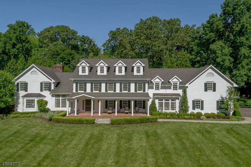 Grandly conceived colonial allowing for 3 living levels (approx.8000 sf.) Luxurious natural materials & professional design have virtually rendered perfection. Rocking chair porch offers an embracing welcome. Expansive windows, classic millwork, 4 fp, marble surfaces, wainscoting, oak floors. Chandeliers, like fine jewels, suspend from ceilings. Hospitality room w/ wet bar off foyer. Exceptional master suite w/ sitting rm opening to balcony. Superlative master bath. Add'l BRs are en suite. Media & exercise rms on 3rd level. Lounge on lower level hosts reclaimed-wood bar seating 7. Brick and RR ties add to the rusticity. Control4 system manages audio & video entertainment indoors & out Outstanding rear grounds w/ tiered, diverse professional landscaping & hardscaping framing 42' x 28' saltwater pool with spa.