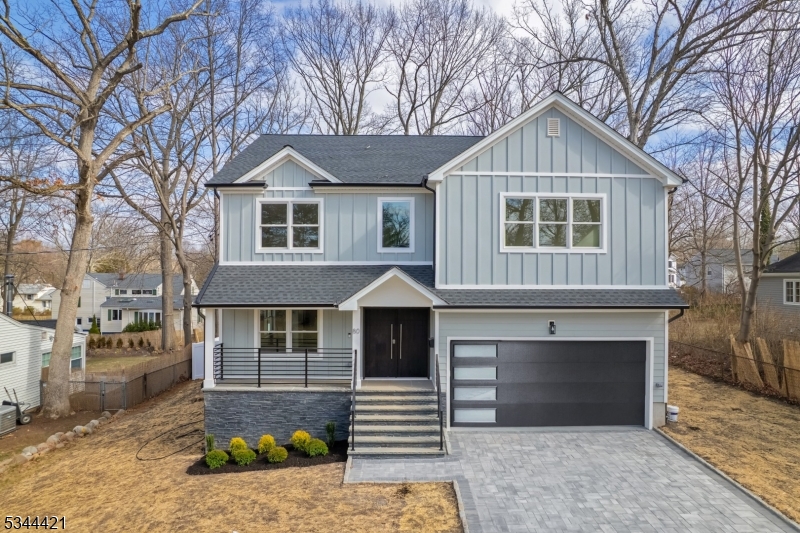 Discover this exquisite new colonial home in one of Livingstons most sought-after neighborhoods.Step through the covered entry porch into a grand double-height foyer,where an abundance of natural light enhances the home's bright and airy ambiance.The main level features a beautiful open layout,including a formal living room,an elegant dining room,a guest ensuite,and a stylish powder room.The gourmet eat-in kitchen is a chefs dream,equipped with custom cabinetry,spacious center island,high-end stainless steel appliances.Sun-drenched and inviting,the family room showcases an elegant fireplace and sliding doors leading to a deck and patio perfect for outdoor entertaining in the flat backyard.Upstairs,are 4 generously sized bedrooms,filled with natural light,a luxurious primary suite featuring his and her walk-in closets,a spa-like bathroom with a soaking tub,stall shower,and dual sinks.The primary suite boasts a private balcony,offering a tranquil retreat.The finished basement offers large open spaces with lots of windows,an office,walk-in closets,a large recreation room,and a full bathroom.Additional modern features include electric car wiring in the garage and a battery backup system for the garage door,ensuring convenience and reliability.This smart home is designed for ultimate comfort and peace of mind.Conveniently located near shopping,top-rated schools,parks,and direct bus service to NYC,this home offers both elegance and convenience.