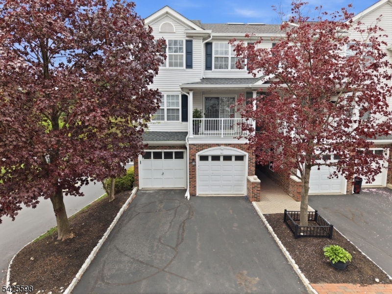 Beautifully maintained 2-bedroom, 2.1-bath end-unit townhouse in a highly desirable community! This one-owner home features a bright, open floor plan with freshly painted interiors and abundant natural light throughout. The main level offers a seamless flow between the Living Room, Dining Room, and Kitchen ideal for everyday living and entertaining. Sliding glass doors lead to a private patio, perfect for outdoor enjoyment. A convenient powder room, pantry, and laundry area complete this level.  Upstairs, you'll find a spacious second bedroom, full hall bath, and a generous Primary Suite, walk in closet, and an en-suite bath featuring a large vanity, stall shower, and tub/shower combination. The fully finished walk-out basement provides additional versatile living space, ideal for a recreation room, home office, or media area, along with ample storage.  Additional highlights include an attached one-car garage with direct entry and the added privacy of an end-unit location. Enjoy community amenities such as a pool and playground, all conveniently located near major highways, shopping, dining, and downtown. This home offers a perfect blend of comfort, convenience, and low-maintenance living.