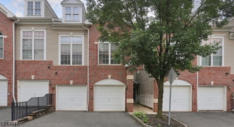 Experience modern luxury living in this beautifully updated townhome nestled in the prestigious Reserve at Scotch Plains. This exceptional residence has been meticulously renovated to offer unparalleled comfort and convenience. Step into the spacious, open-concept living areas adorned with soaring cathedral ceilings & expansive windows, perfect for relaxation & entertaining. Chef's gourmet kitchen is a culinary masterpiece featuring pristine cabinets, state-of-the-art stainless steel appliances, & exquisite countertops with a stylish backsplash. The breakfast bar enhances the space, ideal for casual dining and social gatherings. Upstairs, the oversized bedrooms provide ample retreats. A luxurious primary suite complete with walk-in closets, a private balcony, & lavish primary bath boasting dual sinks, a soaking tub, & separate stall shower. 2 generously sized bedrooms, a conveniently located laundry room, & another full bath, all designed with practicality and comfort in mind. The home is equipped with advanced smart home features, ensuring modern convenience at your fingertips. Located for utmost convenience, enjoy easy access to highways, airports, schools, shopping, and express buses to Port Authority. Benefit from the top-rated schools, and amenities that Scotch Plains offers, while all exterior maintenance is handled by the homeowner simply move in and enjoy the refined lifestyle this townhome affords. Schedule a tour today!