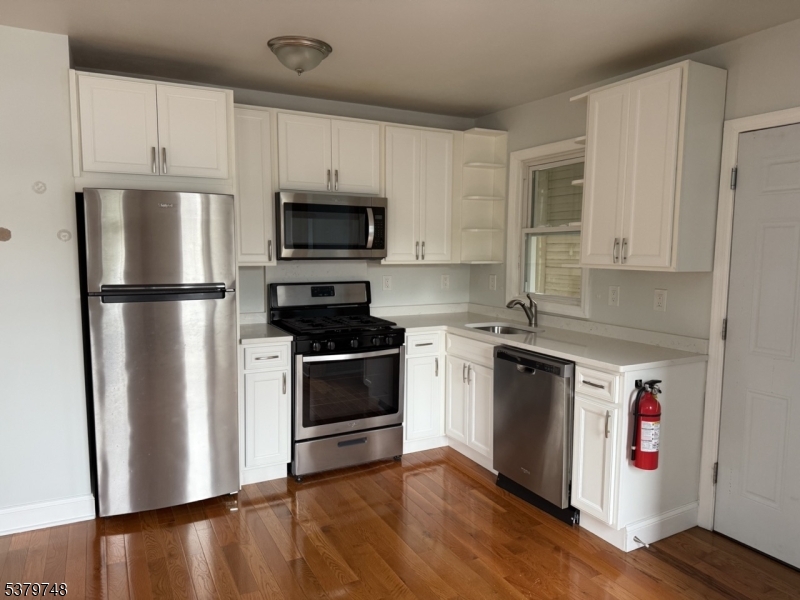 Beautifully renovated and full of charm, this second-floor one-bedroom, one-bathroom unit offers comfort, style, and an unbeatable location. Just moments from local shops, with direct access to bus transit right behind the property, it's ideal for those seeking convenience and connectivity. Inside, you'll find gleaming hardwood floors, a sleek, fully updated bathroom with a stall shower, and a modern kitchen featuring stainless steel appliances. A move-in-ready opportunity in a highly desirable area.